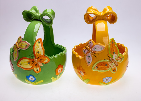 Colorful ceramic Easter decorations with butterfly motifs