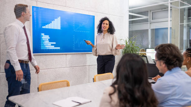 istock Businesswoman giving presentation with graph 1479986851