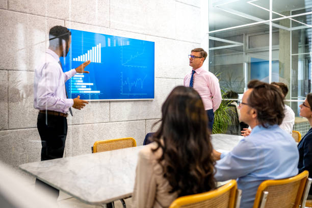 istock Businessman giving presentation with graph 1479986863