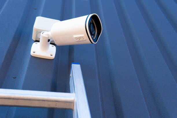 istock CCTV surveillance camera in factory area to control security system area with torch light and copy space 1479990457