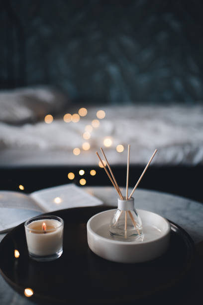 istock Home perfume in glass diffuser in bedroom closeup at night 1479990479
