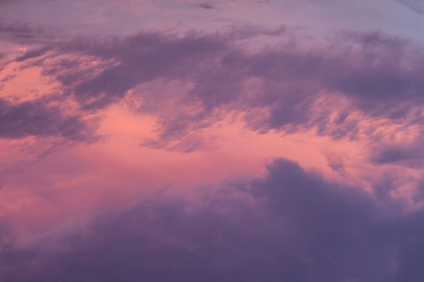colorful clouds in sunset sky stock photo