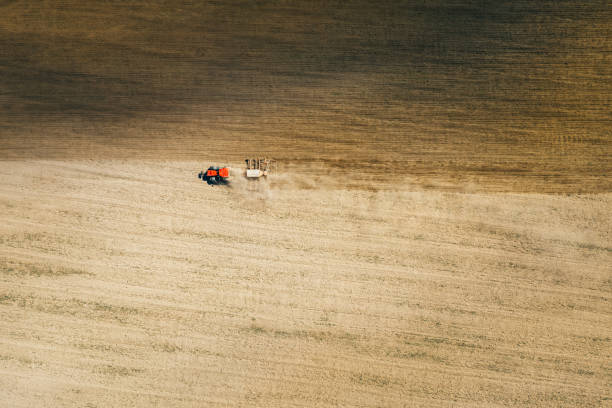 istock Aerial View. Tractor With Seed Drill Machine Sowing The Seeds For Crops In Spring Season. Beginning Of Agricultural Spring Season. Countryside Field Landscape. Natural Rural Background 1479991921