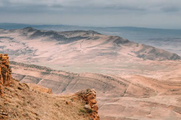 Photo of Autumn Landscape Desert Steppe. Concept Of Endless Expanses. Amazing View Of Alone. Desert Looks Like Alien Landscape. As Though Like Marsian Landscape Desert. Mars Red Planet Imitation