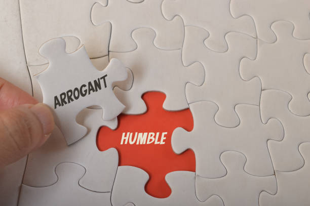 istock Jigsaw puzzle with text ARROGANT and HUMBLE. 1479997965