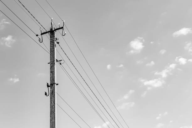 istock Power electric pole with line wire on light background close up 1479999288