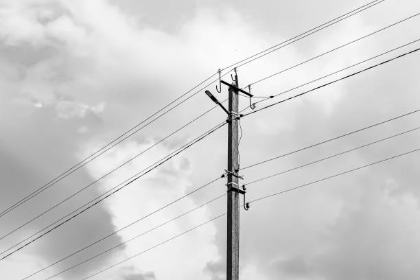 istock Power electric pole with line wire on light background close up 1479999319