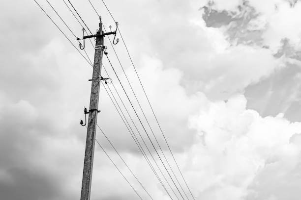 istock Power electric pole with line wire on light background close up 1479999395