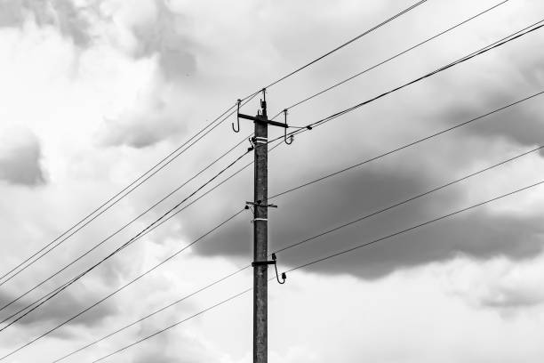 istock Power electric pole with line wire on light background close up 1479999460