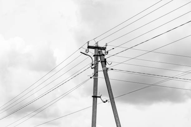 istock Power electric pole with line wire on light background close up 1479999461