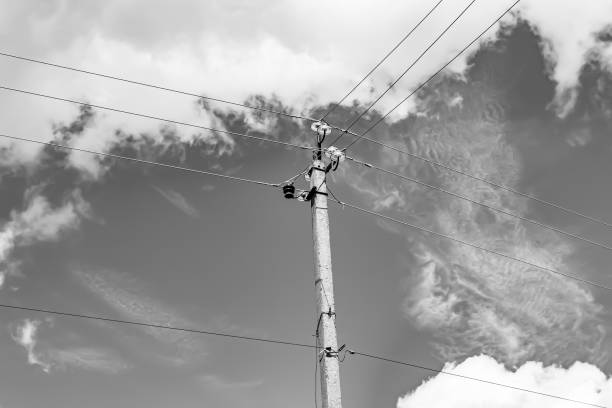 istock Power electric pole with line wire on light background close up 1479999495