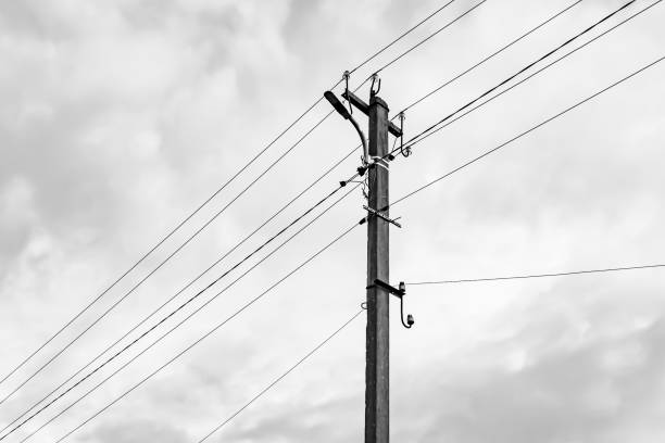 istock Power electric pole with line wire on light background close up 1479999657