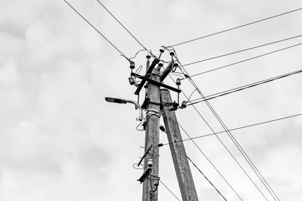 istock Power electric pole with line wire on light background close up 1479999660