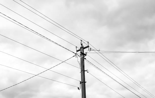 istock Power electric pole with line wire on light background close up 1479999690