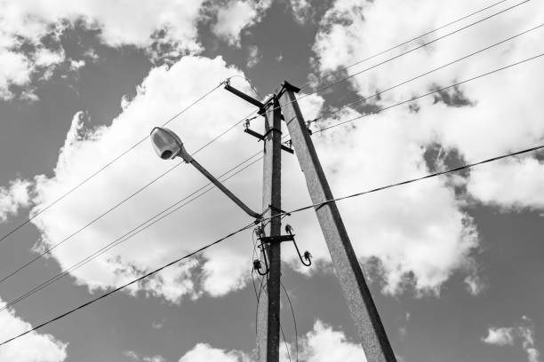 istock Power electric pole with line wire on light background close up 1479999761