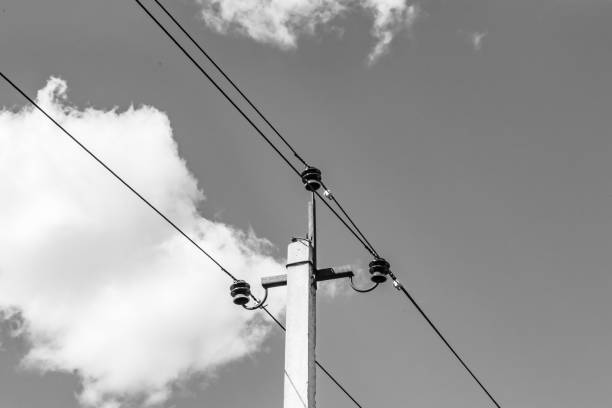 istock Power electric pole with line wire on light background close up 1479999856