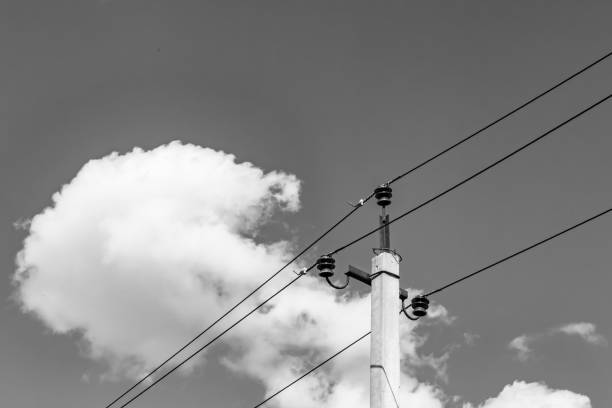 istock Power electric pole with line wire on light background close up 1479999858