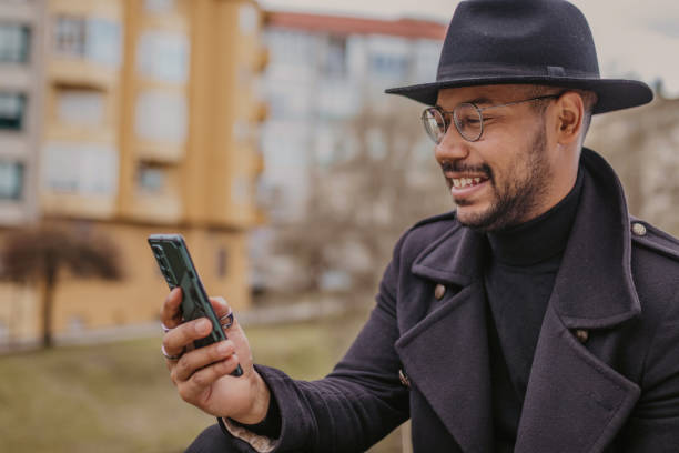 istock man on the street with mobile phone 1480002262