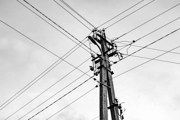 istock Power electric pole with line wire on light background close up 1480002484
