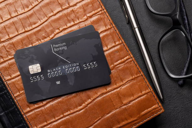 istock Black credit card on office table 1480004958