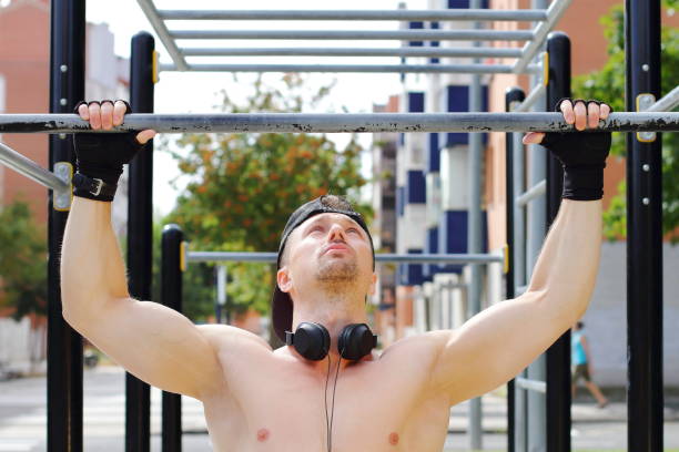 istock Man doing workout on horizontal bar on the street 1480005002