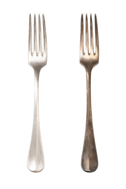 Polished and tarnished sterling silver fork handles