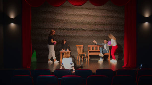 istock Group of theater stage performers rehearsing on stage 1480011142