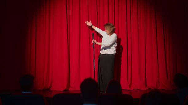 istock Female director talking to audiences and introducing performance and play on stage 1480013502