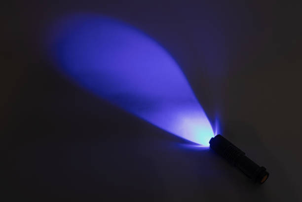 Light from an ultraviolet LED flashlight. UV 365 nm LED lamp stock photo
