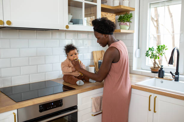 istock Baby boy eating fruit for the first time 1480014995
