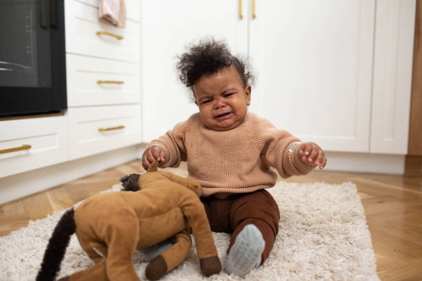 istock Portrait of sad black baby crying alone 1480015143