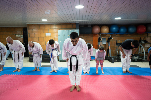 Sensei and students bowing during a karate class