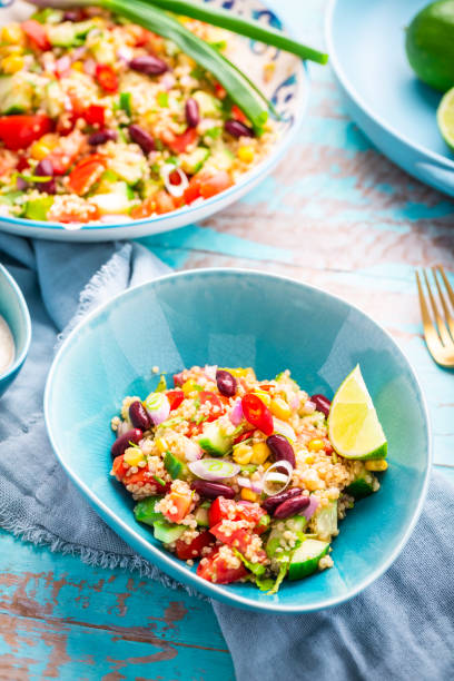 istock Mexican quinoa black bean salad with fresh tomatoes, cucumbers, onion and cilantro 1480016231