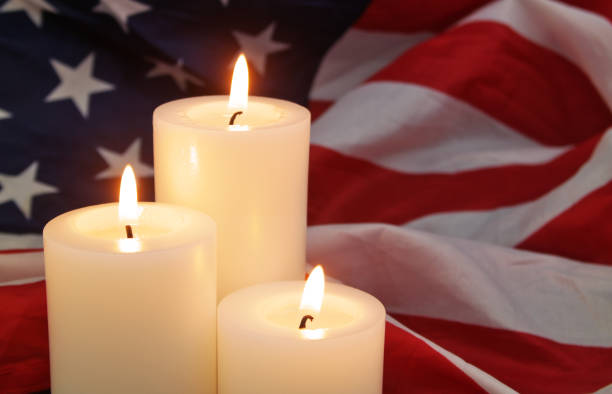 istock Burning candles on USA flag background. 1480016335