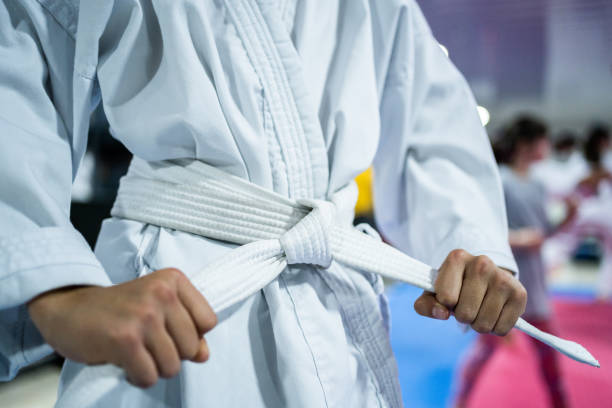 istock Close-up of a man tying the belt at karate class 1480018068