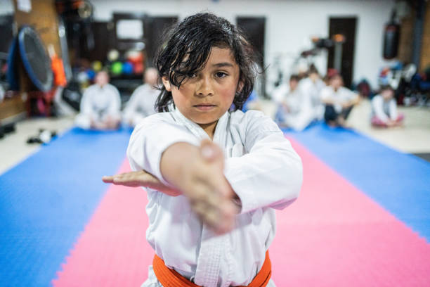 istock Portrait of a child boy doing exercises during a karate class 1480020841