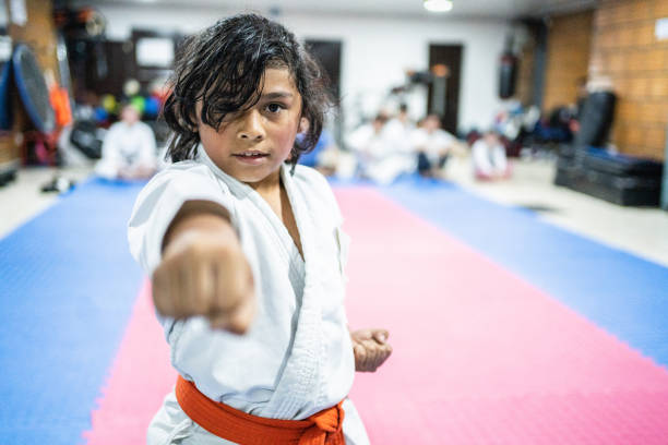 istock Portrait of a child boy doing exercises during a karate class 1480020850