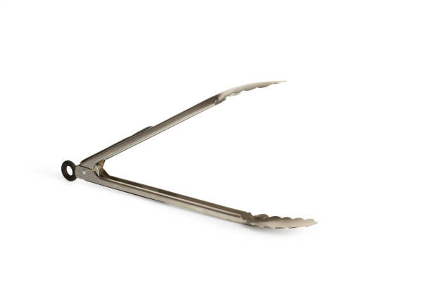 istock Stainless steel large grill tong on a white background with copy space 1480022975