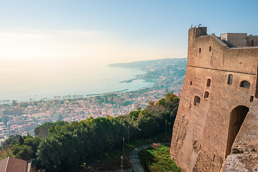 Naples, Italy - December 20, 2022: High angle view of Naples city by the coast in Italy of the old, historic center of the city at sunrise seen from Sant Elmo Castle. Italy travel landmark view