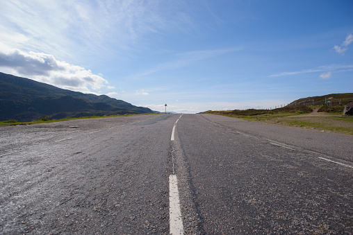 Open road on beautiful sunny day, Scottish Highlands near Loch Ness and Inverness.