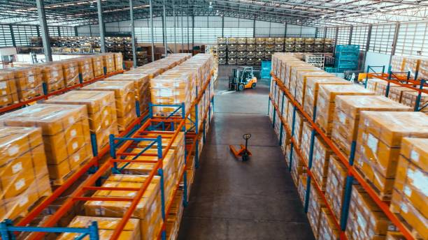 High angle view, merchandise packages stores on shelf rack in factory warehouse. Logistic industry business, industrial job career, factory work environment concept