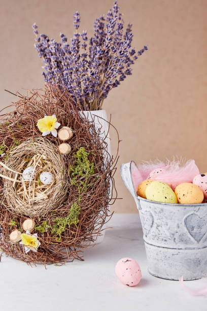 istock Bouquet of lavender, nest, bucket with Easter eggs - Easter decorations. 1480031415