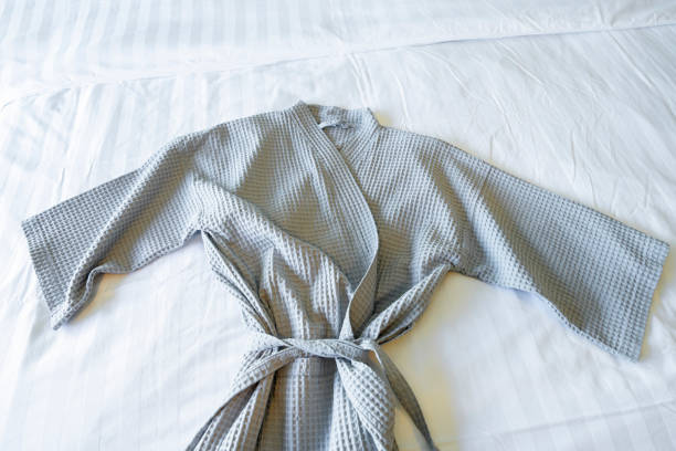 istock A Gray color Bathrobe on a white bed. 1480032875