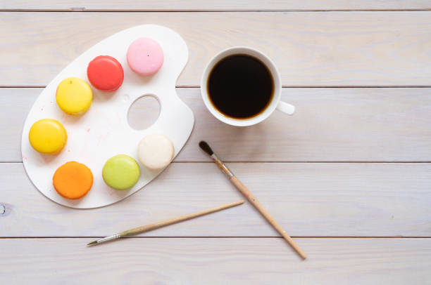 Cup of coffee and colorful macaron
