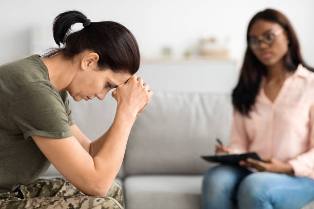istock Depressed Female Soldier With Mental Problems Having Meeting With Psychotherapist 1480036364