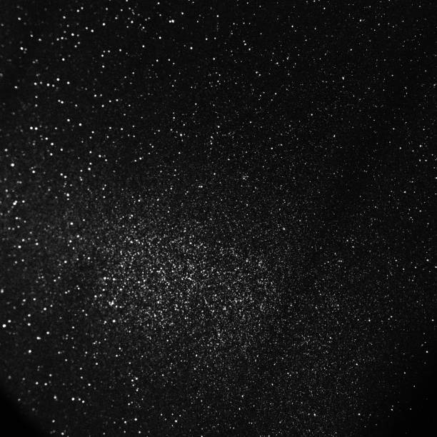 istock Black bokeh texture on black background. White glitter or illuminated dust 1480039331