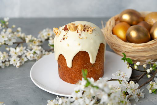 Traditional Easter cake with nuts on gray background close up