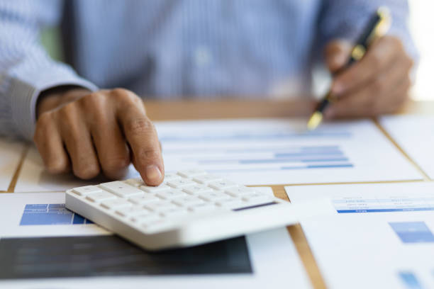 istock Businessman working with financial documents analyzing business finances and planning budget management. Financial planning and accounting. 1480045320