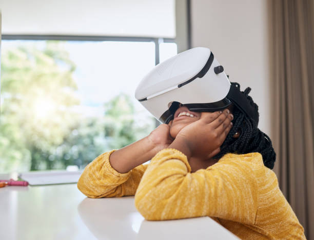 istock Vr, education and child with headset in happy virtual class for elearning, gaming or video streaming online. Futuristic entertainment, fun and innovation in ux technology for children in home school. 1480045548