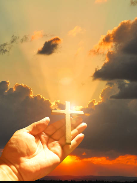 istock Good Friday concept. Cross in arm on sky background. 1480047636
